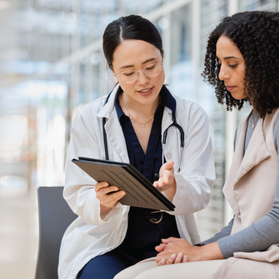 Two women, a patient and a doctor, consult.